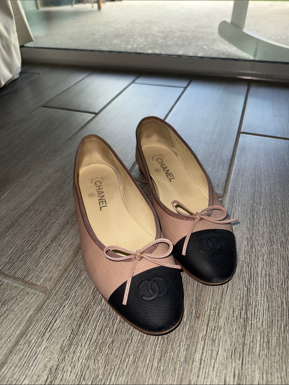 CHANEL Pink and Black Cap-Toe Ballet Flats
